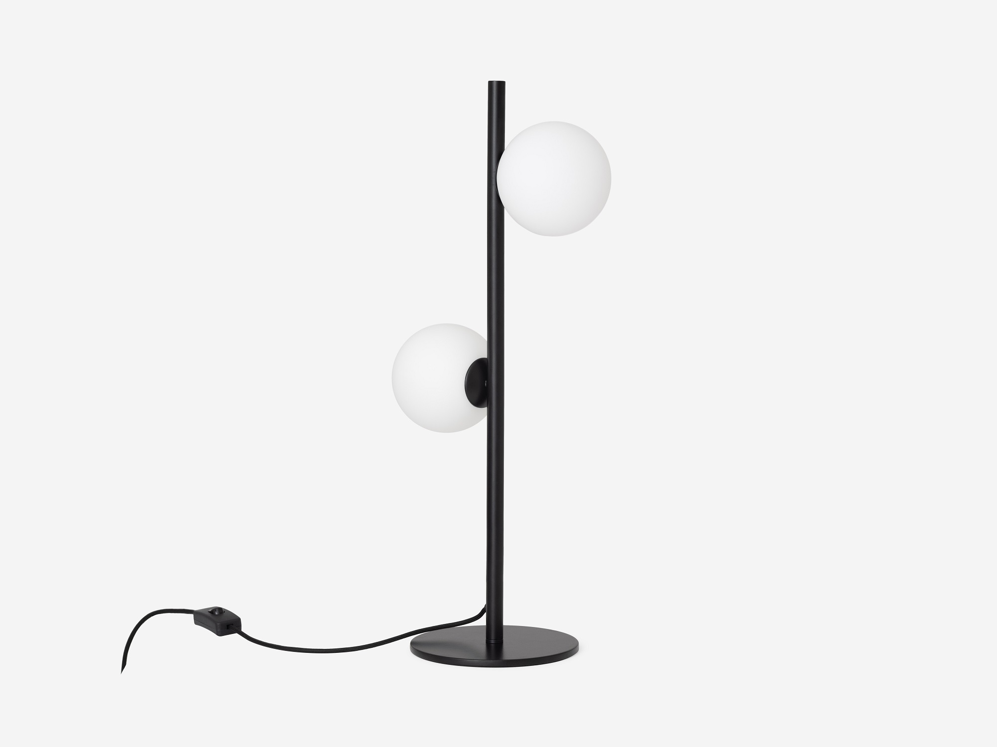 front view of the eq3 black stem table lamp